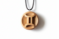 Handcrafted Gemini zodiac pendant in beech wood with natural tung oil finish
