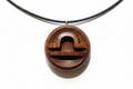 Wooden pendant with geometric design on a white background