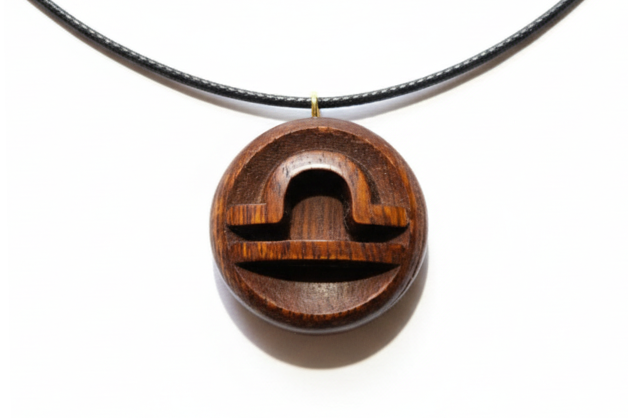 Wooden pendant with geometric design on a white background