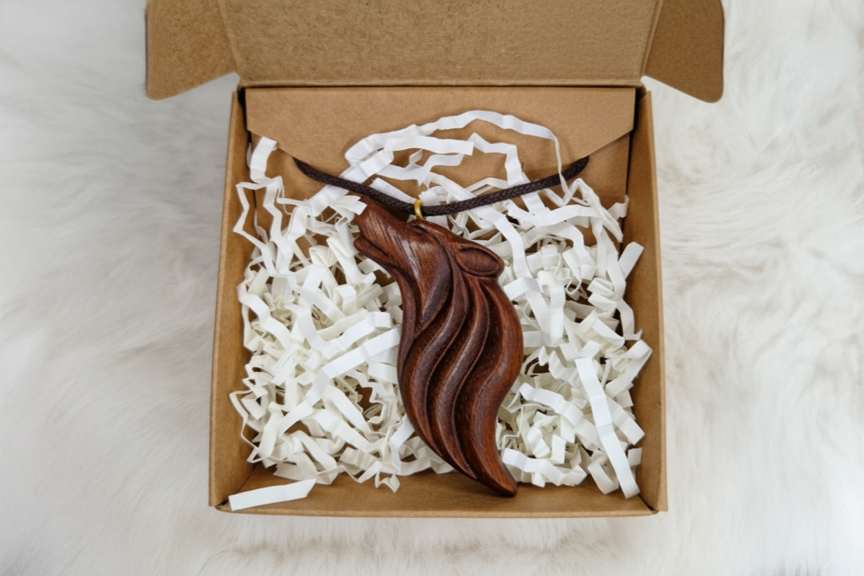 Wengé wolf talisman pendant in premium kraft gift box with white protective filling and leather cord